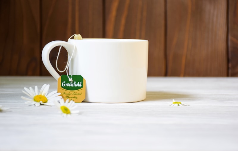 A white coffee mug sitting on top of a table