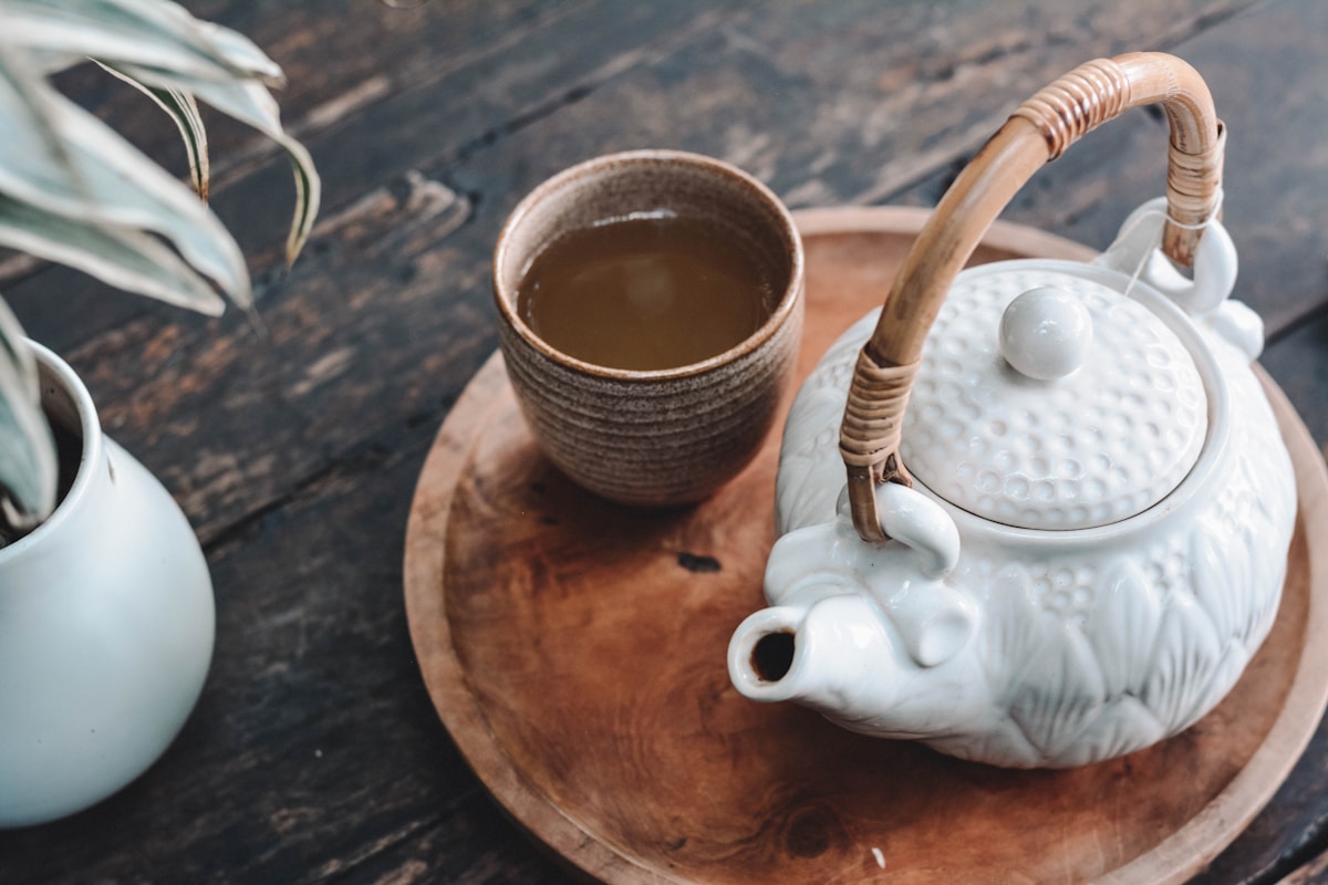 Various tea types arranged on a wooden surface